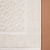 Set: velour bathrobe with shawl collar and cotton bath mat