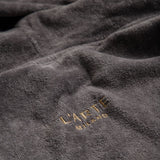 Set: velour hooded bathrobe and cotton bath mat